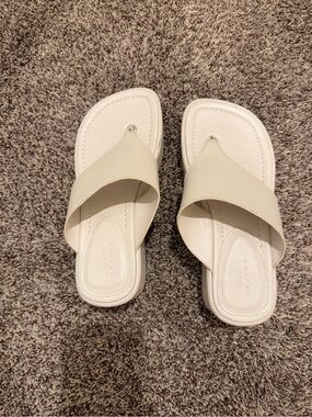 Women's ivory flip flop platforms